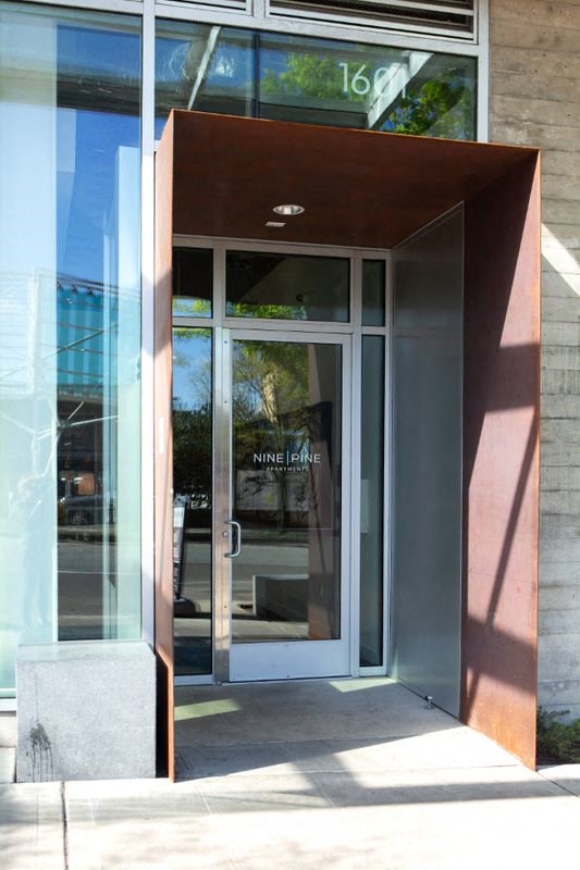 the entrance to a building with glass doors