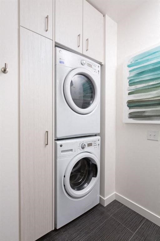 a white washer and dryer in a white closet