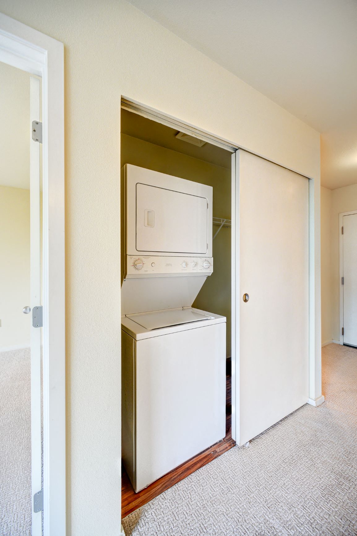 a washer and dryer in a closet in a room