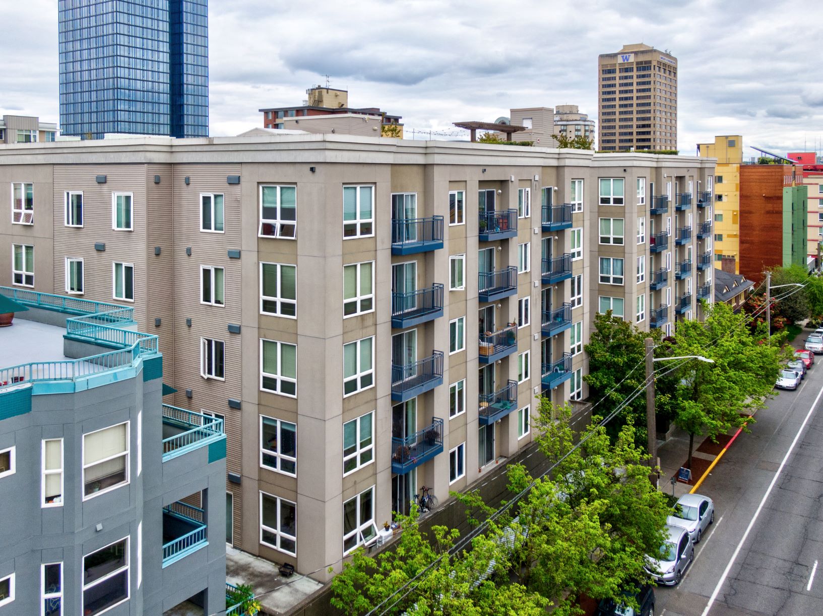 an aerial view of a large apartment building in the city