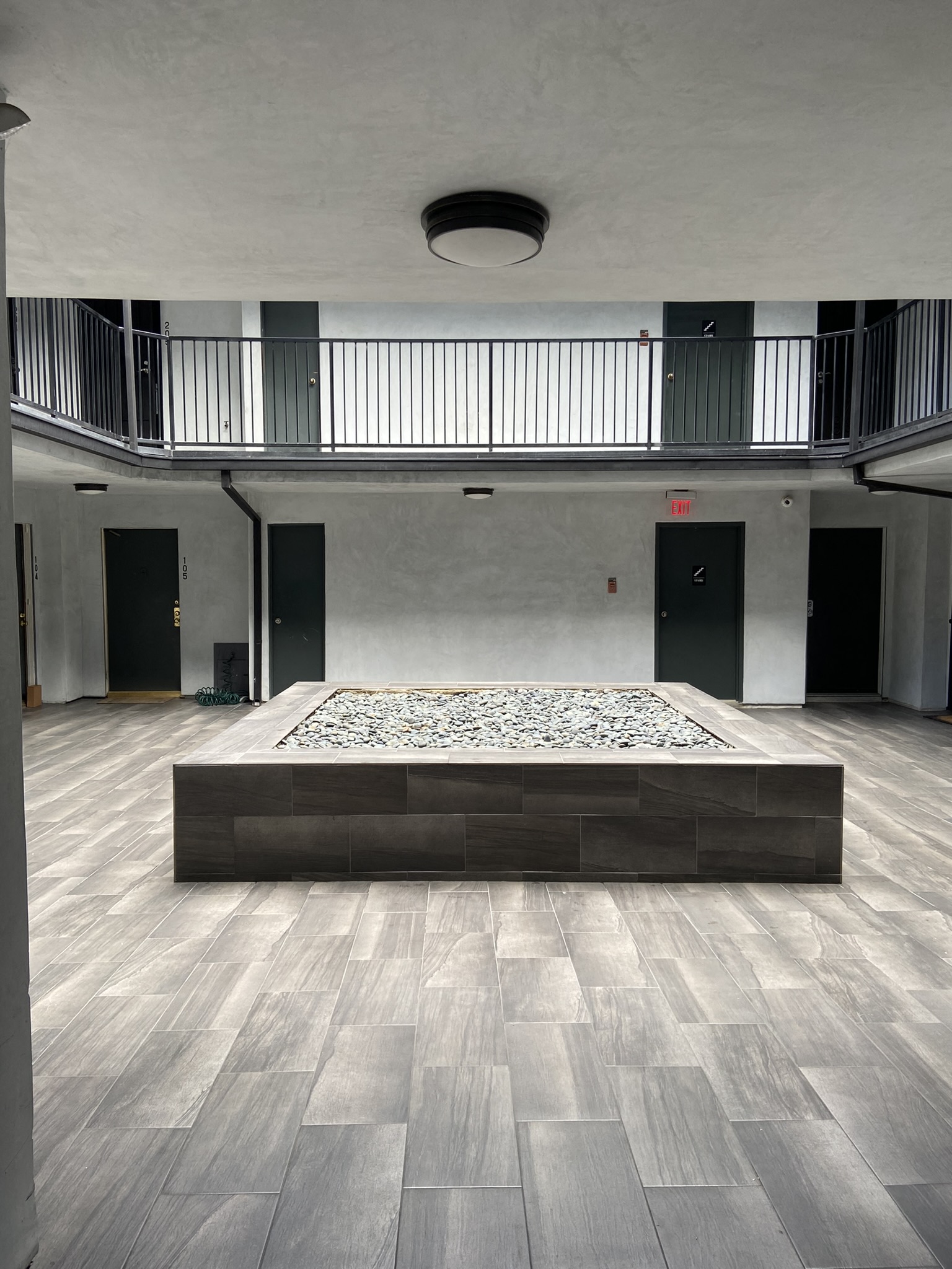 the main room of the building has a dance floor and a balcony
