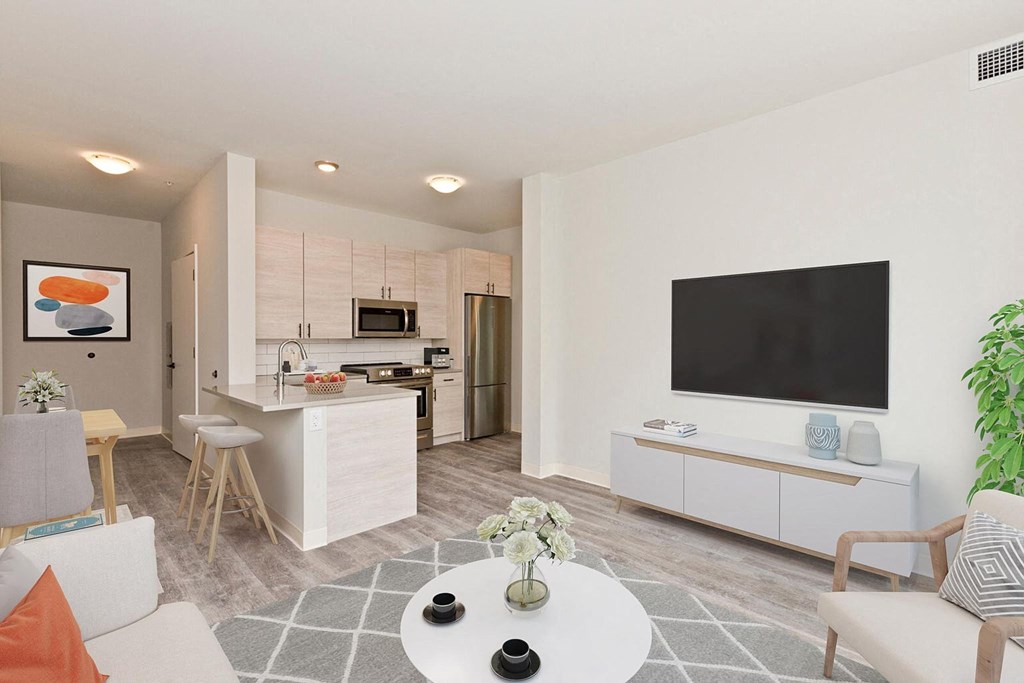 a living room with a kitchen and a table
