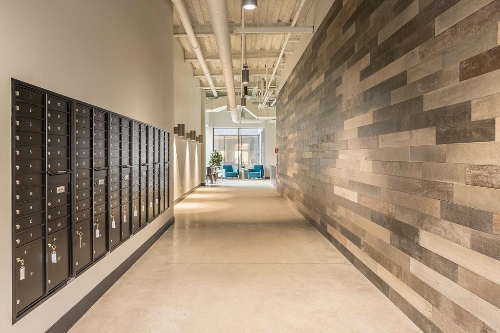 a hallway with vaulted ceilings and lockers in a building