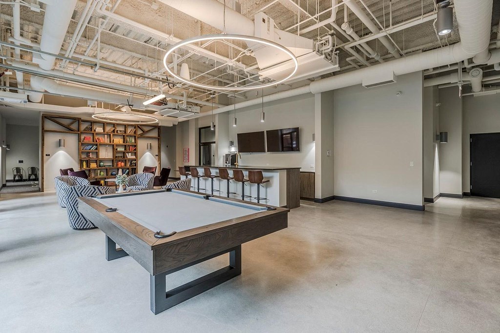 a game room with a pool table