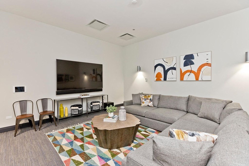 a living room with a couch and a tv