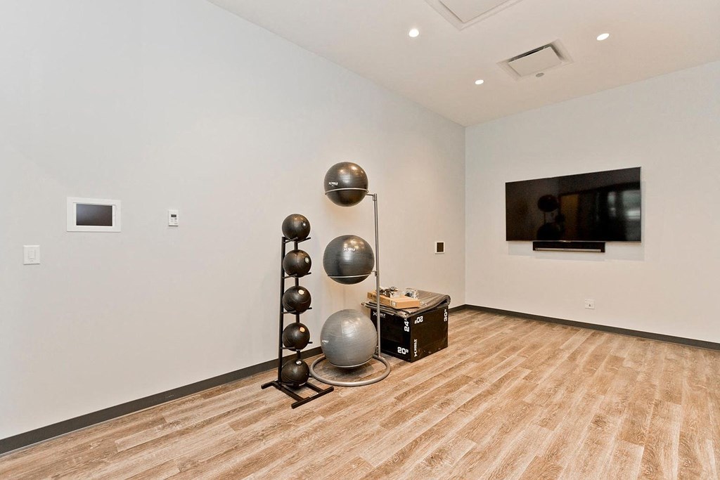 a room with a tv and some spheres in it