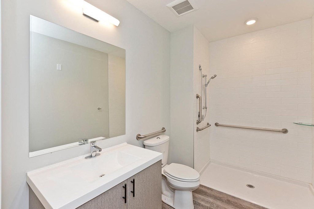 a bathroom with a sink toilet and a shower