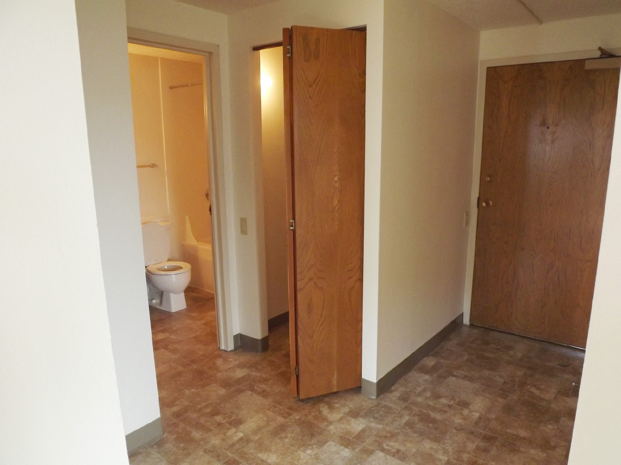 one  bedroom bathroom entry view