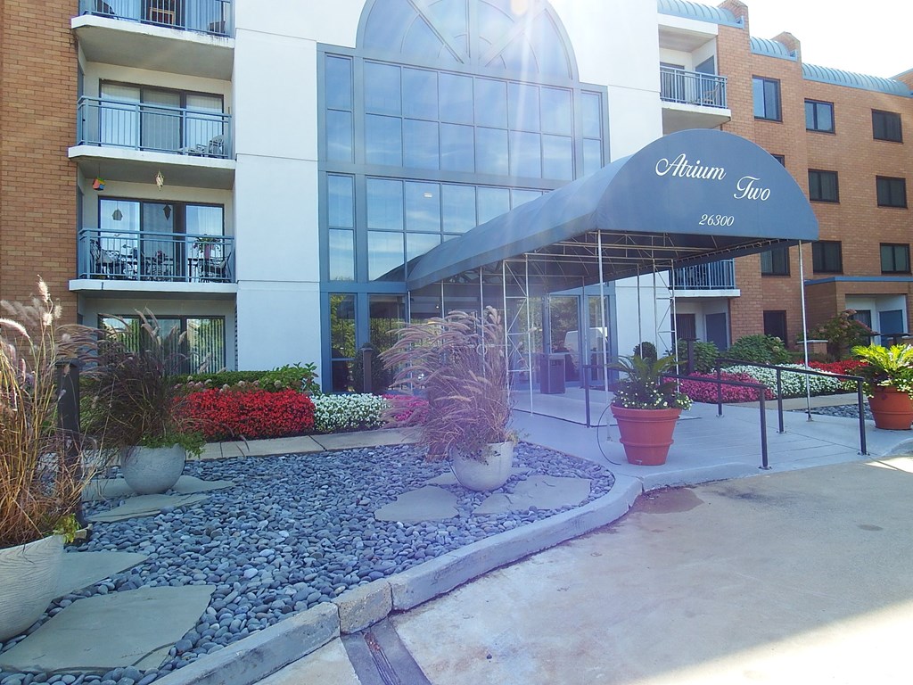 a view of the front of an apartment building with an awning