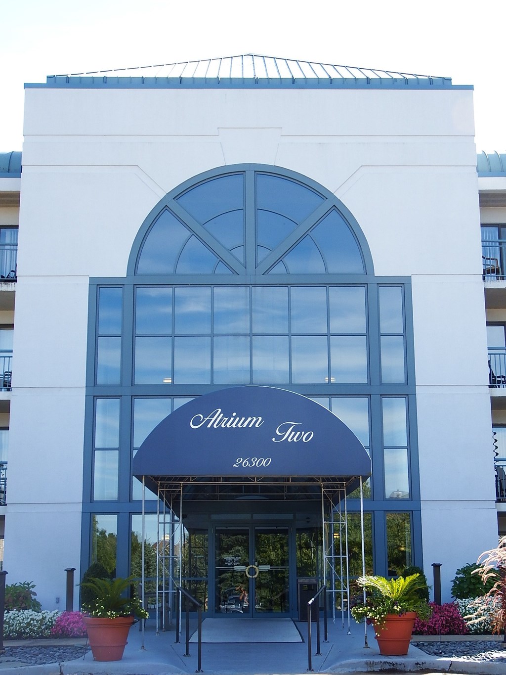 a view of the front of the alhambra inn building