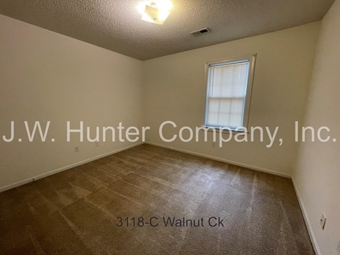 A room with J.W. Hunter Company, Inc. written on the wall.