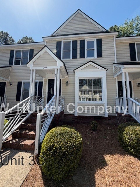 A house with the text "W. Hunter Company" and "Unit 3" on the front yard.