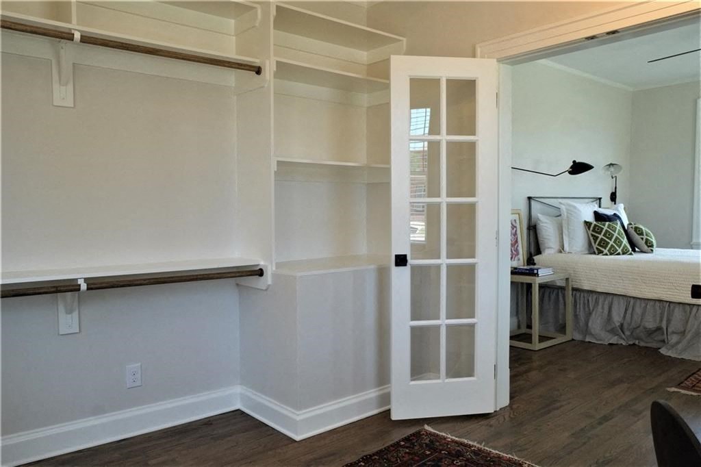 a room with a bed and a sliding door