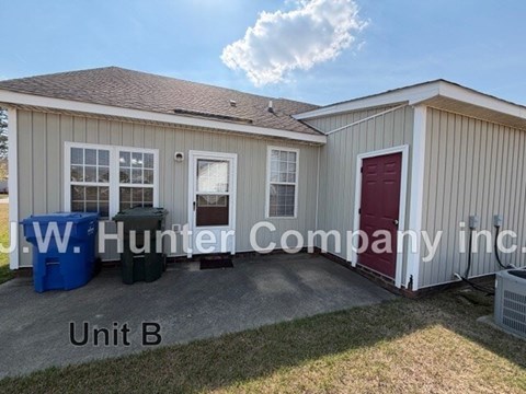 A small building with the sign "J.W. Hunter Company Inc." on it.
