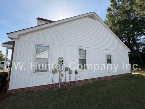 A white building with the name W.W. Hunter Company Inc. on it.