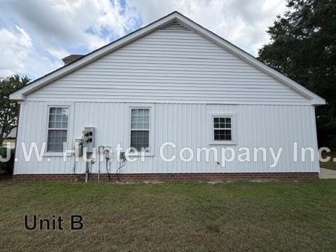 A white building with the words J.W. Hunter Company Inc. on it.