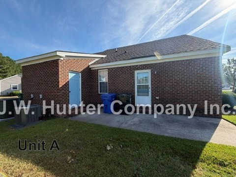 A brick building with the sign J.W. Hunter Company Inc. Unit A.