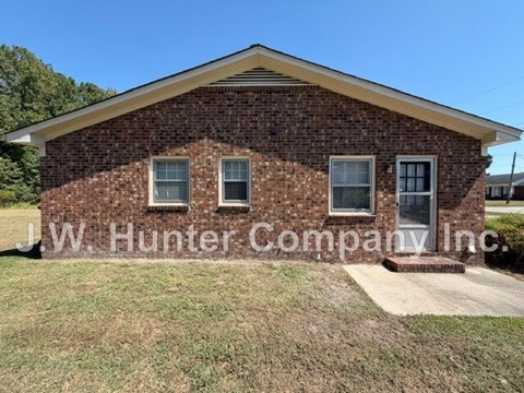 A brick building with the name J.W. Hunter Company Inc. on it.