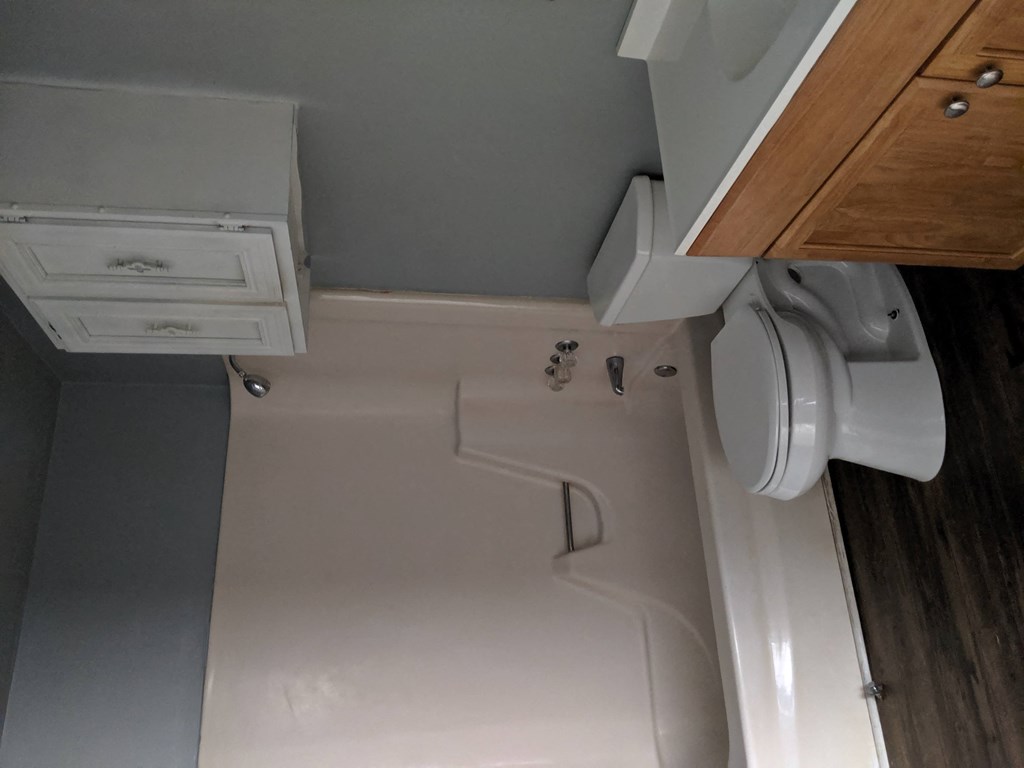 the bathroom is equipped with a toilet and a sink