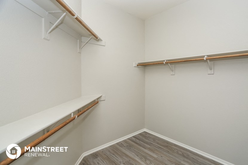 the closet in our 2nd floor niche with shelves and hangers