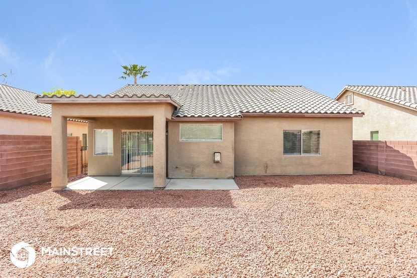 a new home with a driveway and a house with a roof