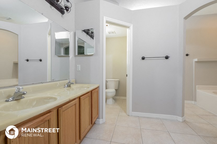 a bathroom with a sink and a mirror and a toilet