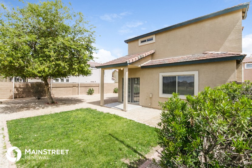 a house with a yard and a tree