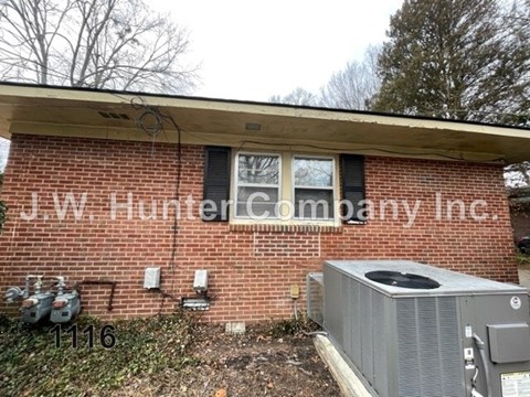 A brick building with the name J.W. Hunter Company Inc. on it.