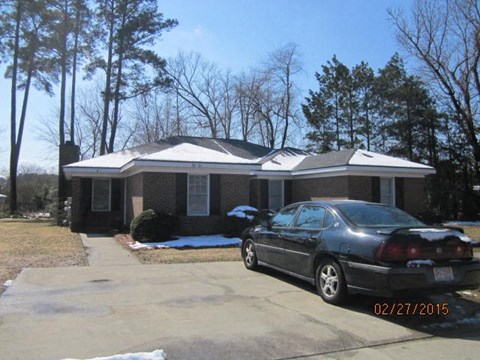 a house with a car parked in front of it