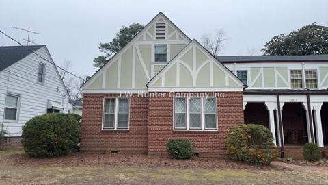 A white building with a sign that says J.W. Hunter Company.