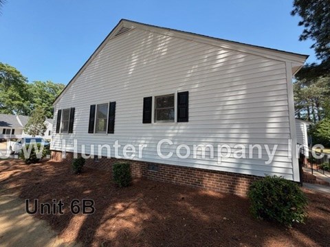 A white building with the words Hunter Company on it.