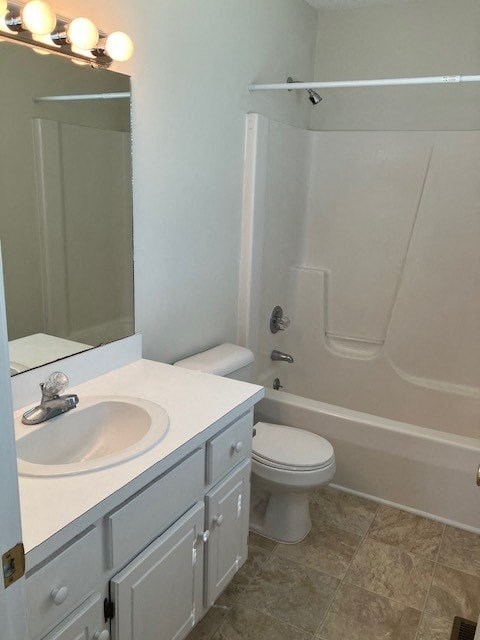a white bathroom with a sink and a toilet