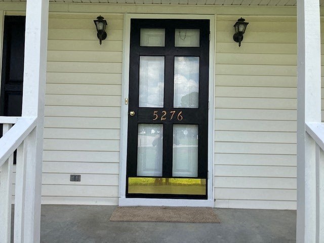the front door of a house with a black door