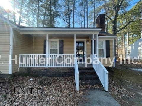 A house with the text "Hunter Company Inc." on the side.