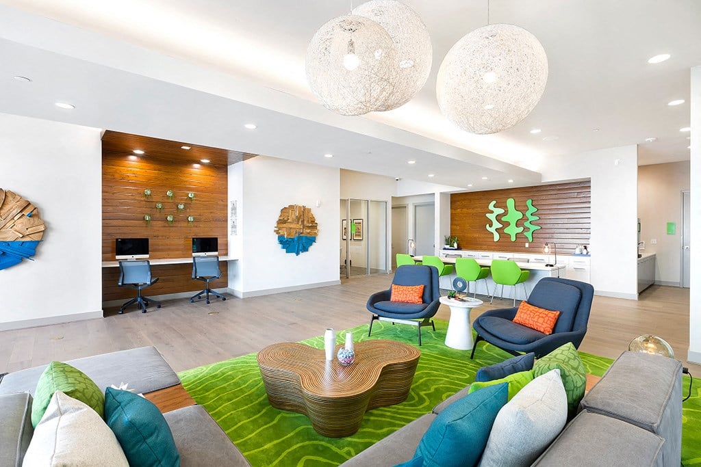 a living room with couches and chairs and a table