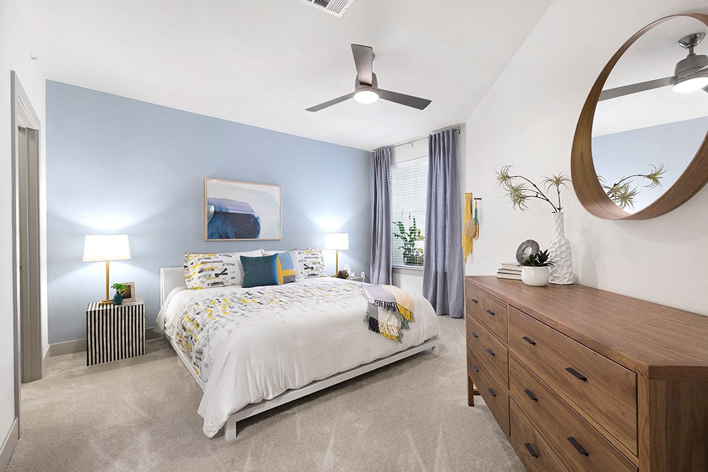 a bedroom with a bed and a dresser