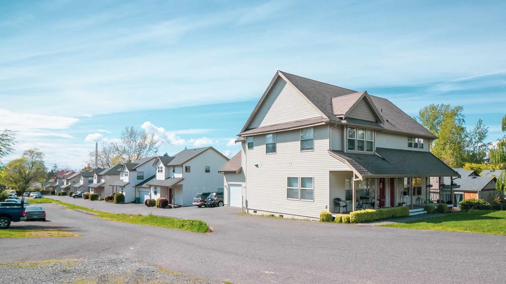 a row of houses on the side of a street