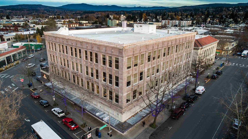 an aerial view of a large building in a city