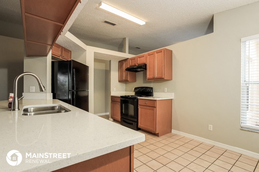 a kitchen with a sink and a counter top