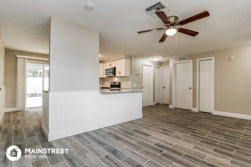 the kitchen is open to the living room and dining room