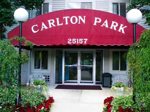 the entrance to the carillon park building with a red awning