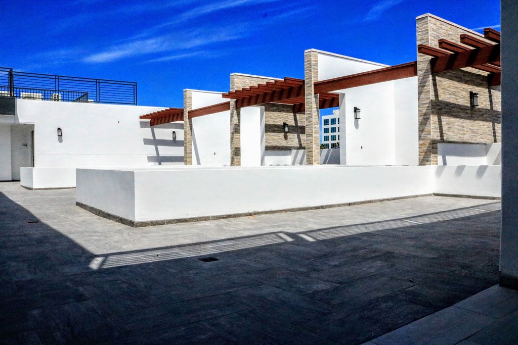 a building with white walls and a blue sky