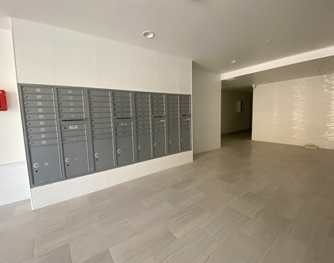 a view of the communal lockers in the hallway of a building
