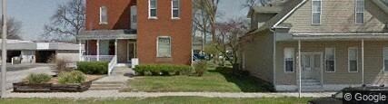 the front yard of a house with a yard in front of it