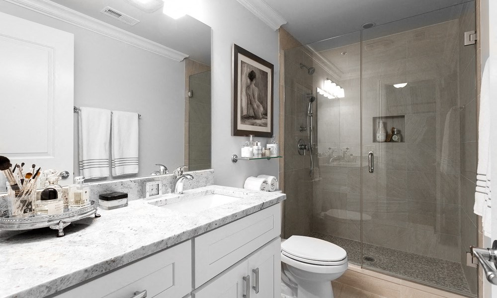 Glass front shower with modern counter and cabinets | Monroe Aberdeen  Place