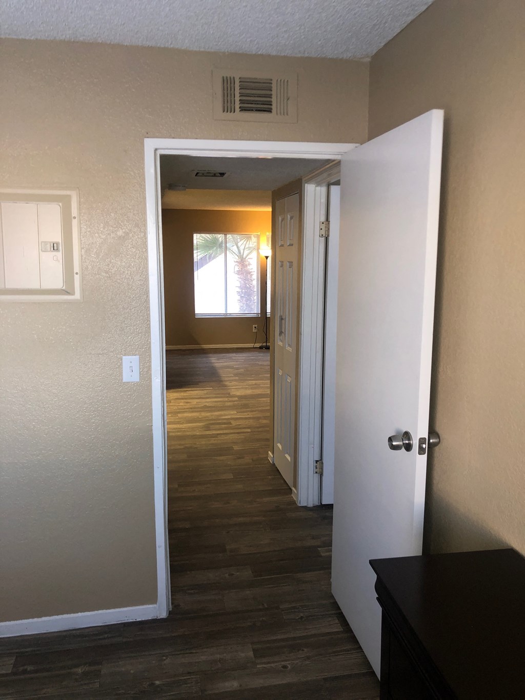 a view of the hallway from the living room into the bedroom