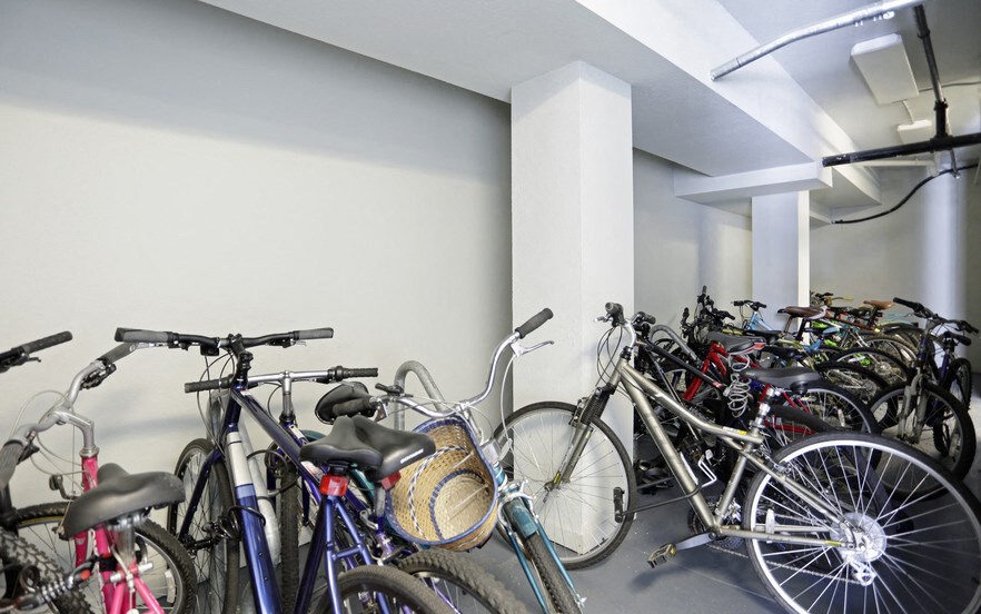 a group of bikes parked in a parking garage