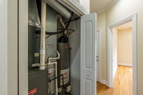 A room with a furnace and pipes.