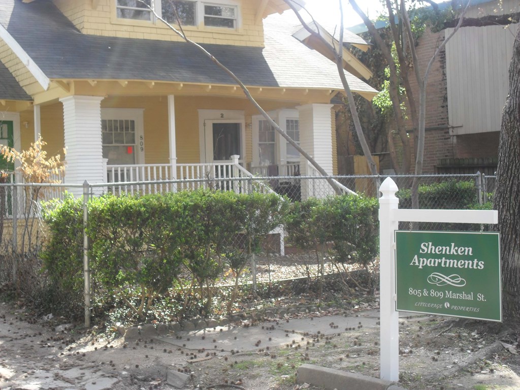 a house with a sign in front of it