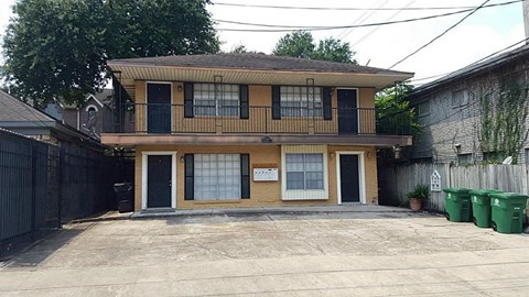 the front of a house with a parking lot